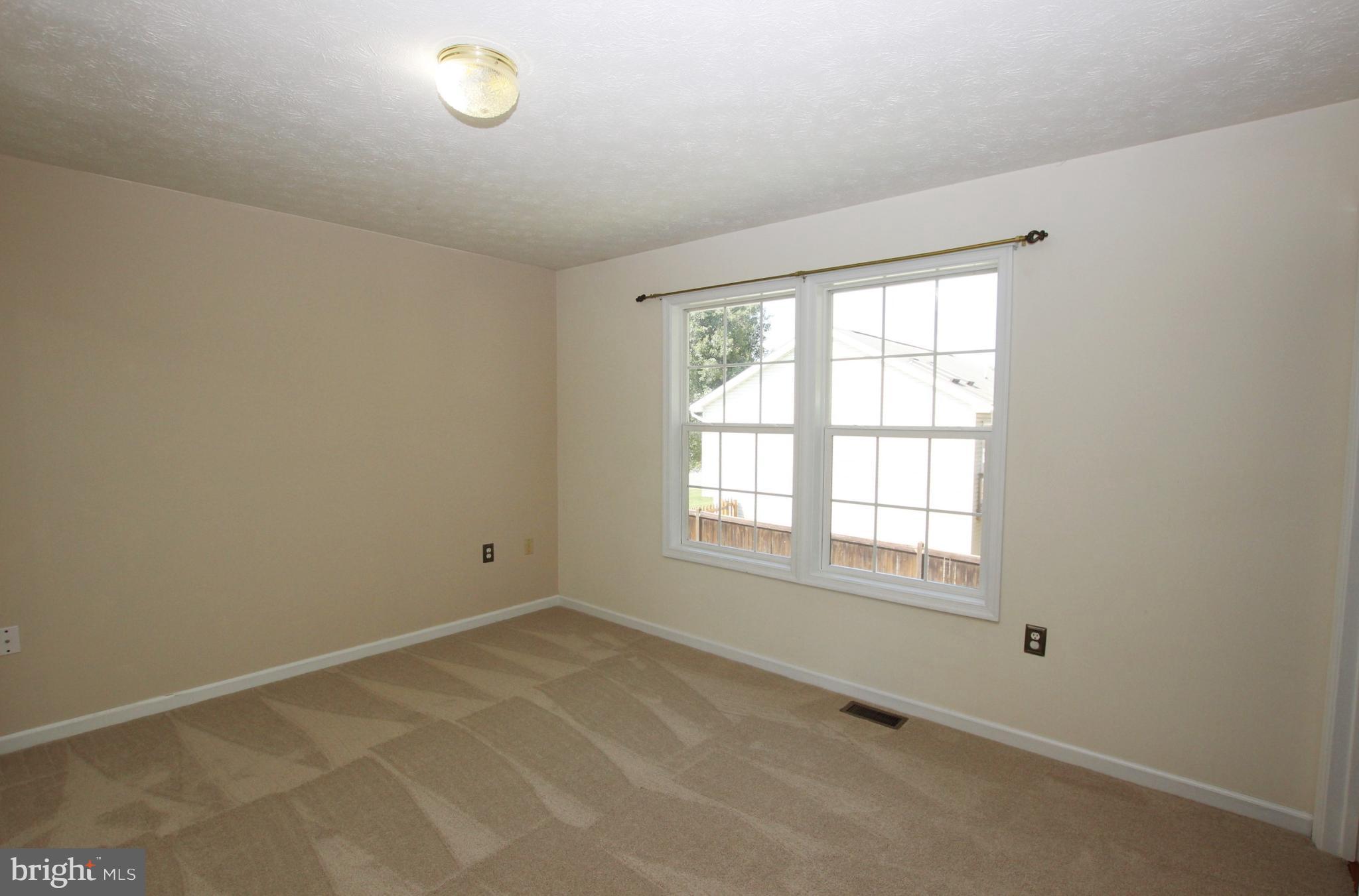 12 Cottontail Court Ranson, WV 25438 - Photo 11 of 29 an empty room with a empty space and a window
