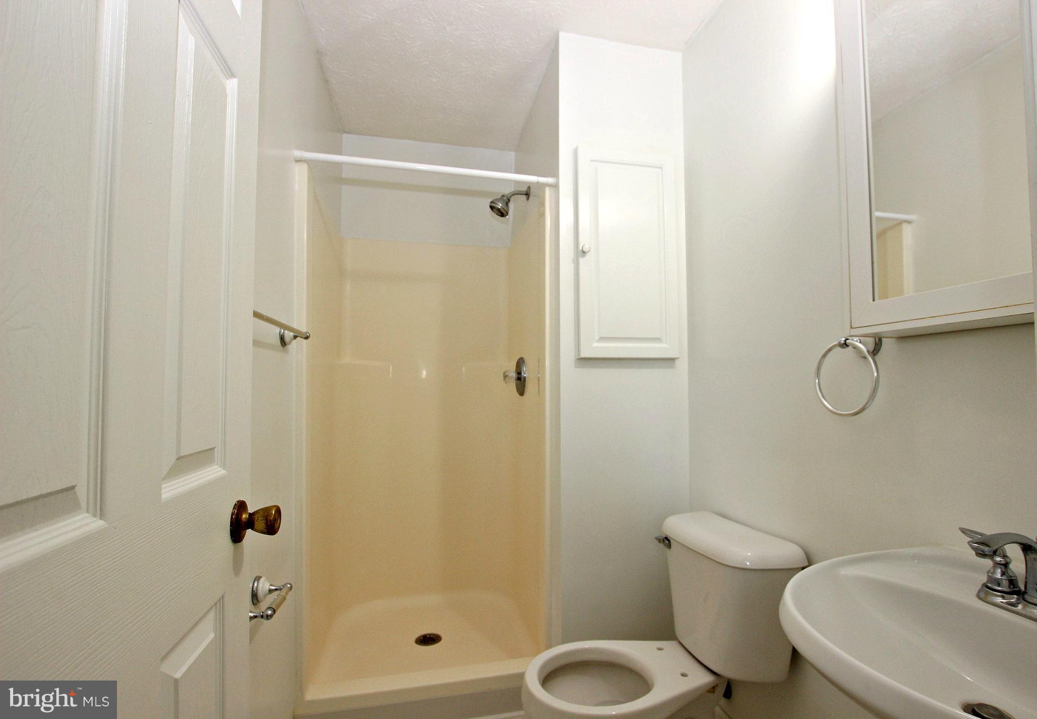 12 Cottontail Court Ranson, WV 25438 - Photo 12 of 29 a bathroom with a shower and toilet