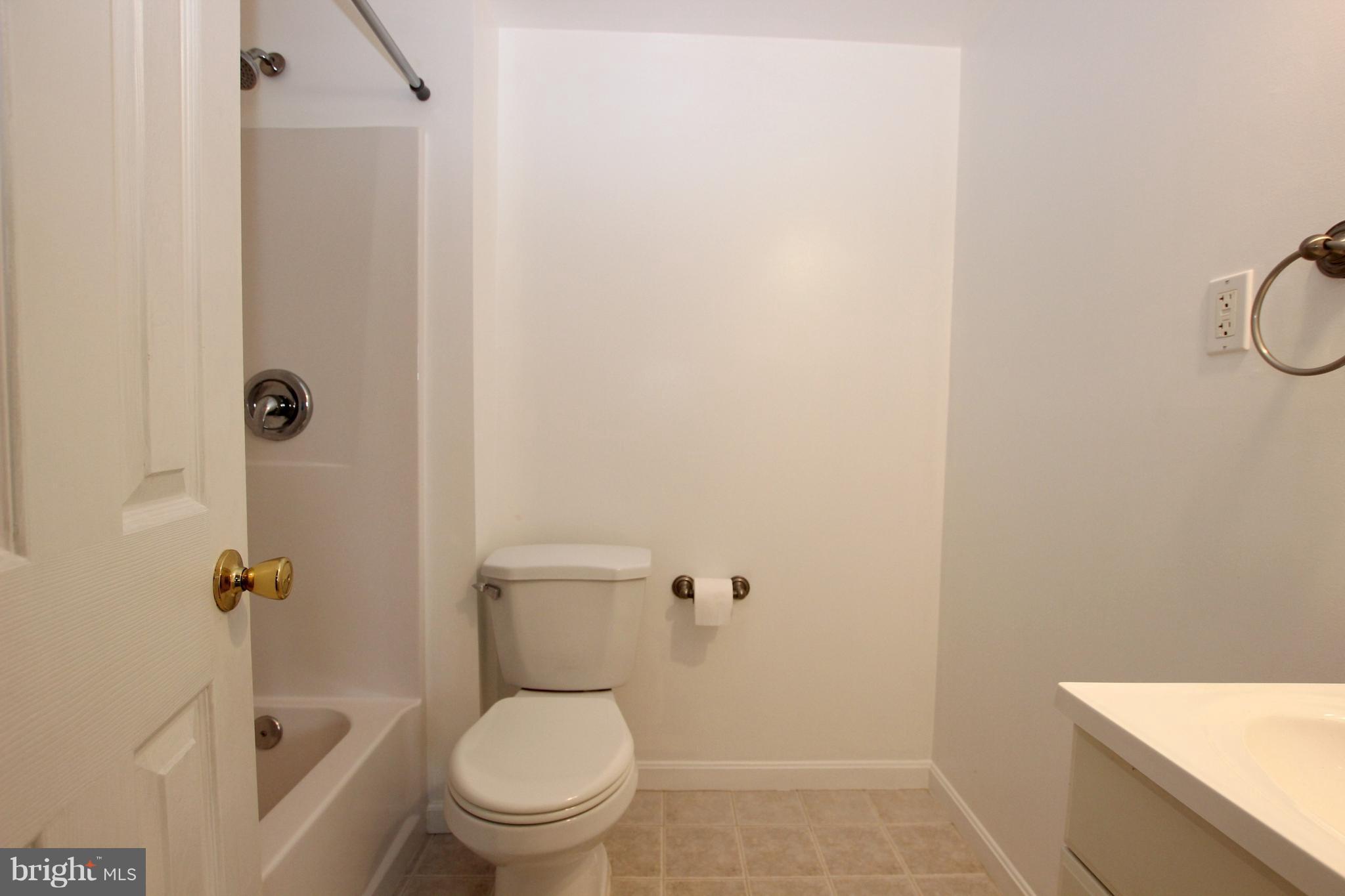12 Cottontail Court Ranson, WV 25438 - Photo 23 of 29 a white toilet sitting next to a bathroom sink