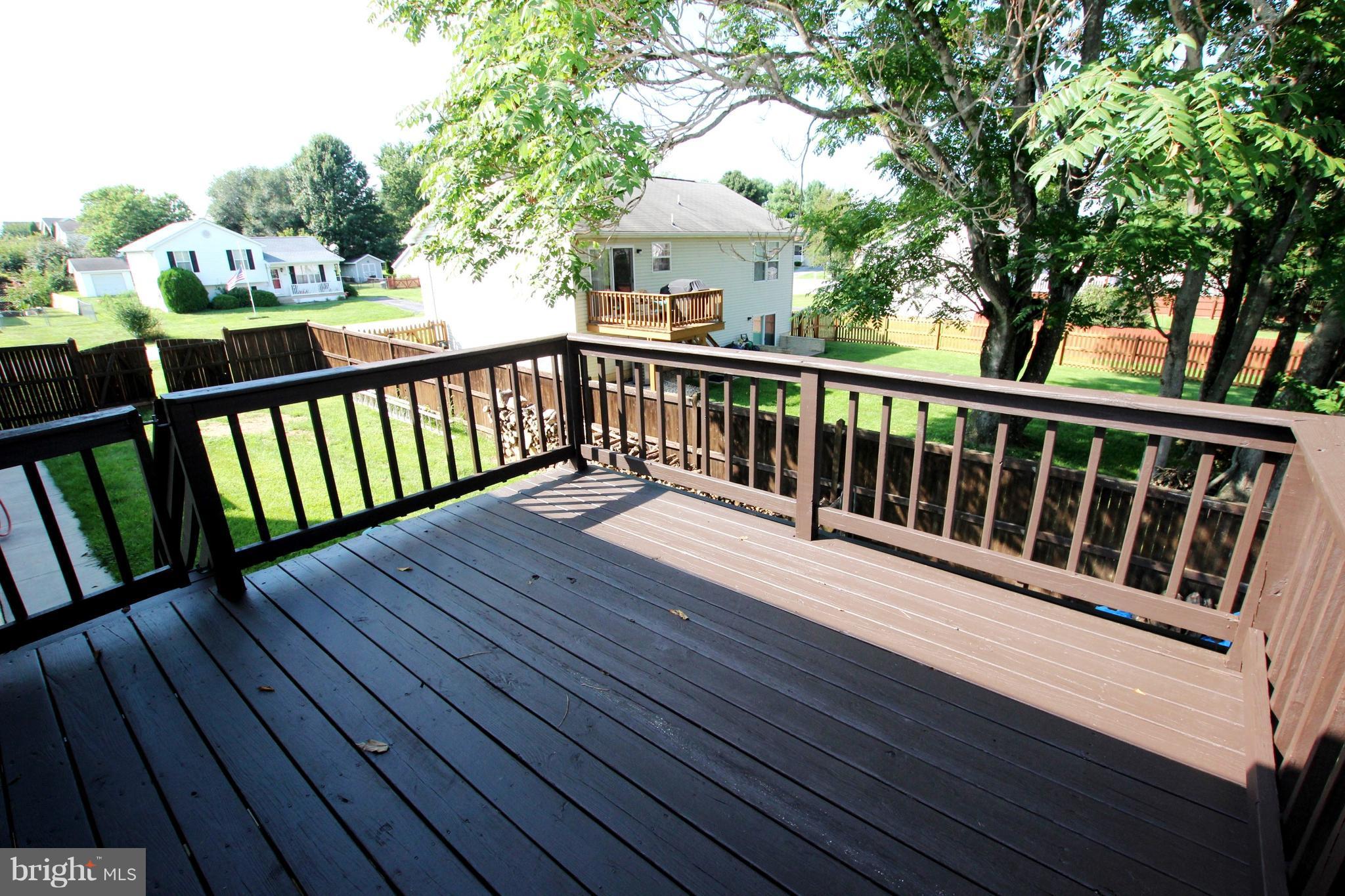 12 Cottontail Court Ranson, WV 25438 - Photo 25 of 29 a view of deck with furniture and trees around