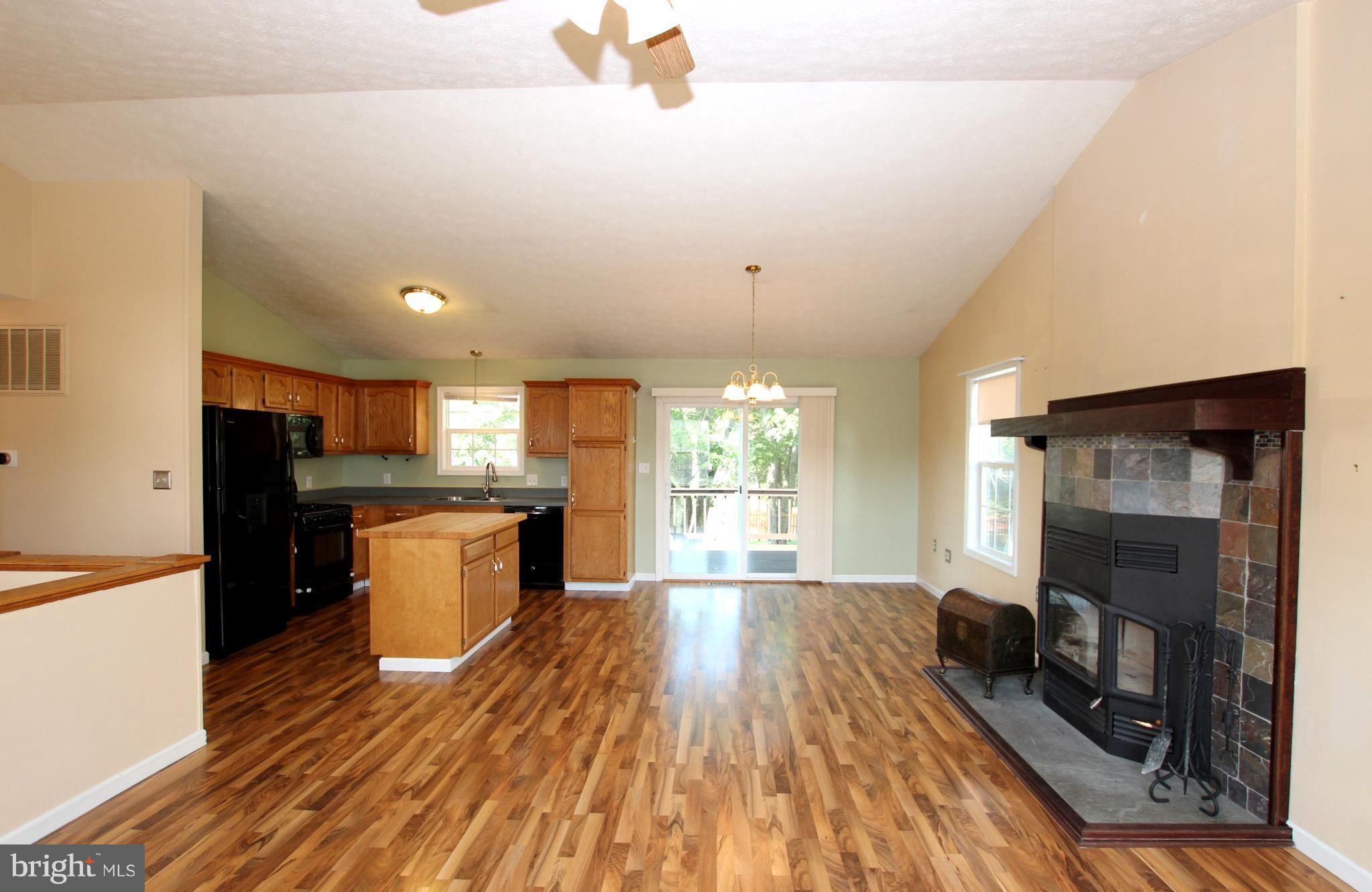 12 Cottontail Court Ranson, WV 25438 - Photo 6 of 29 a kitchen with a refrigerator and a stove top oven
