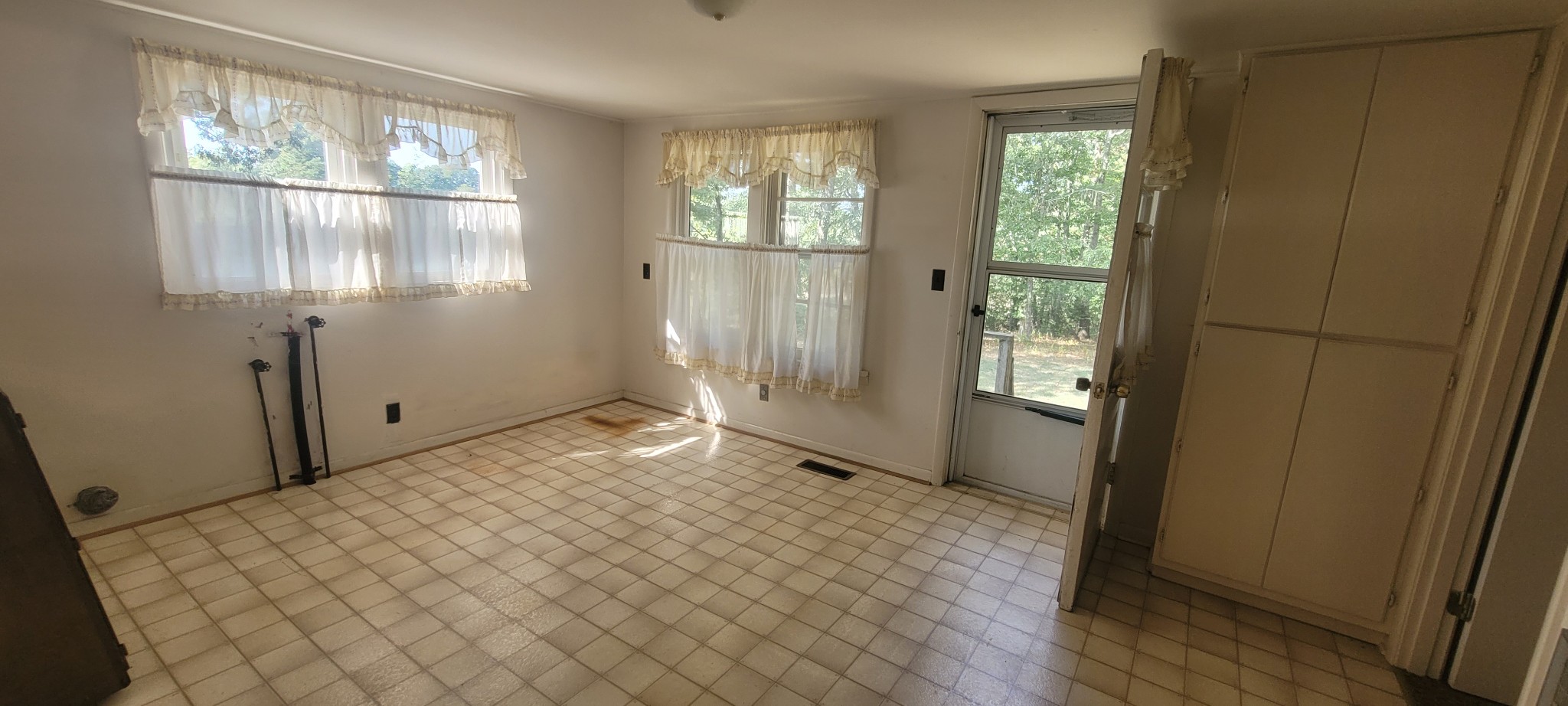 10183 New Hope Road Bon Aqua, TN 37025 - Photo 14 of 27 Extended kitchen space/Dining area has pass through window at kitchen sink, also washer dryer connections are in this space.