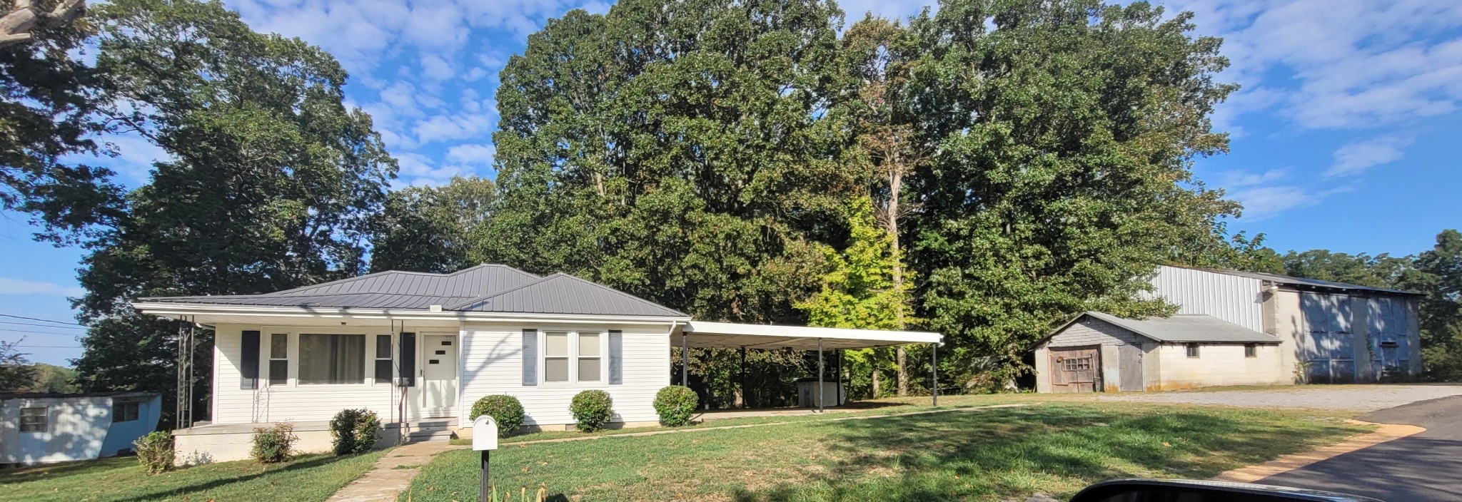 10183 New Hope Road Bon Aqua, TN 37025 - Photo 18 of 27 Handsome cottage style home, with carport and separate extra large block workshop, higher ceilings in rear. Shop has electricity.