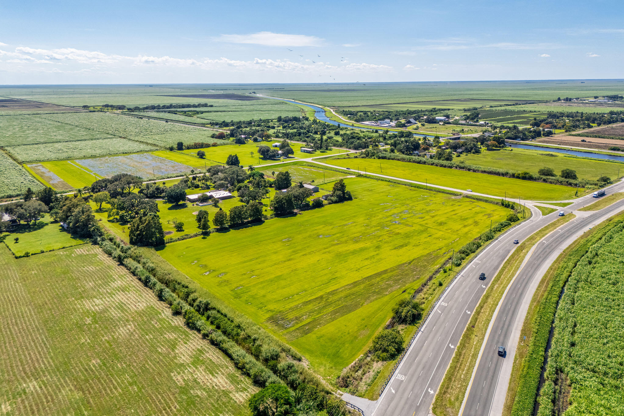 0 East Corkscrew Boulevard Clewiston, FL 33440 - Photo 3 of 8 a view of a swimming pool and an ocean view