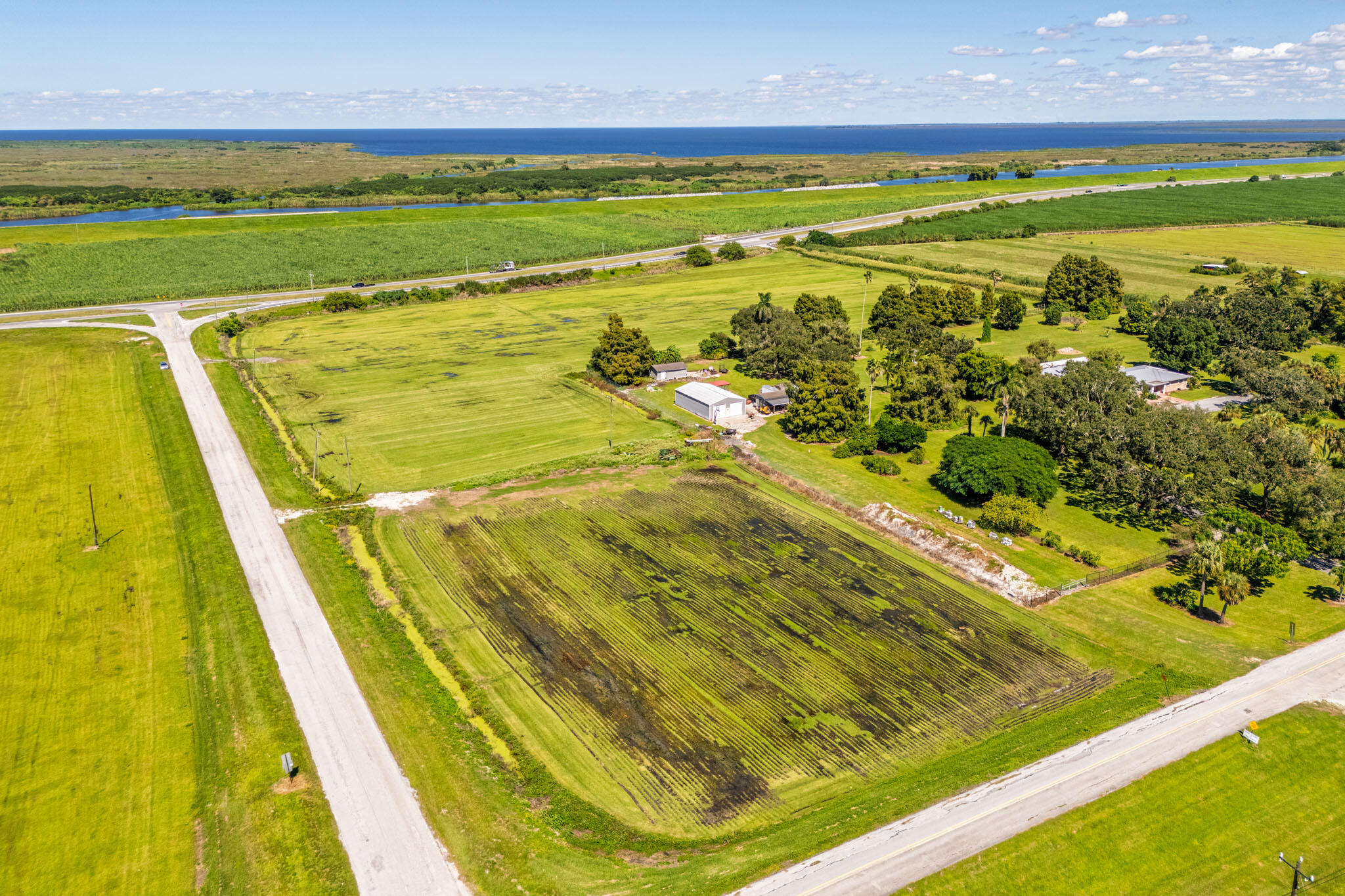 0 East Corkscrew Boulevard Clewiston, FL 33440 - Photo 6 of 8 a view of an outdoor space and a lake view