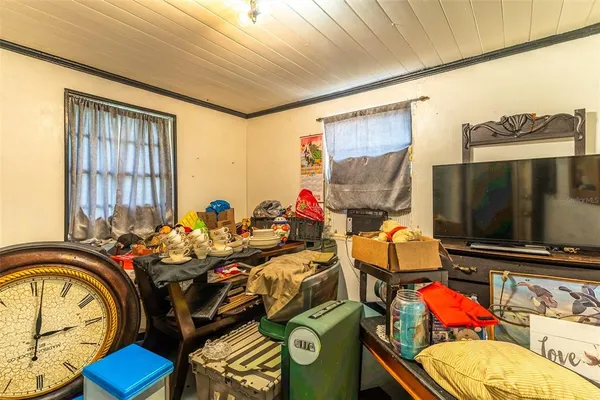a utility room with dryer washer and a view of living room