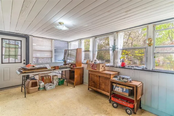 a room with furniture and a large window