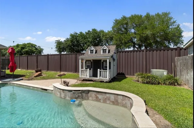 a view of a house with swimming pool