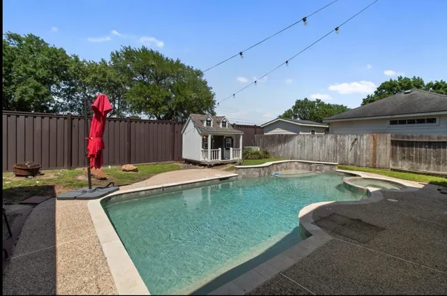 an aerial view of houses with yard
