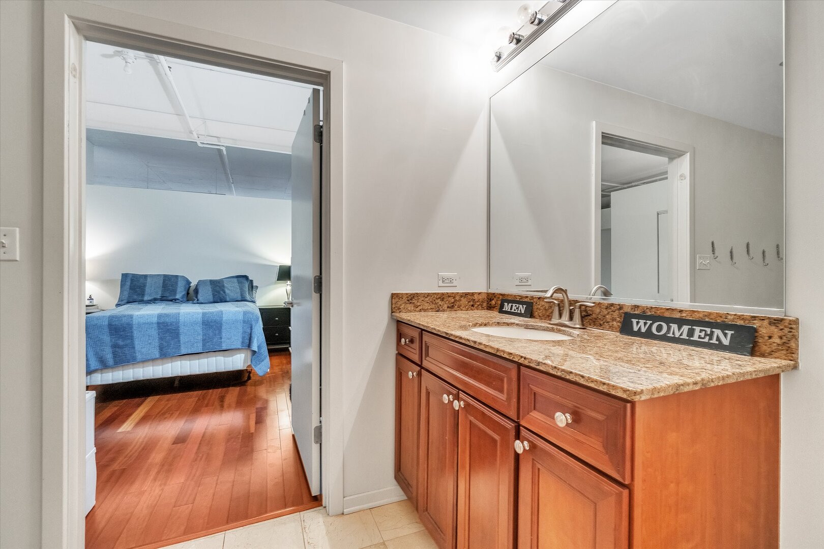 520 South State Street, Unit 805 Chicago, IL 60605 - Photo 15 of 24 a bathroom with a sink and a mirror