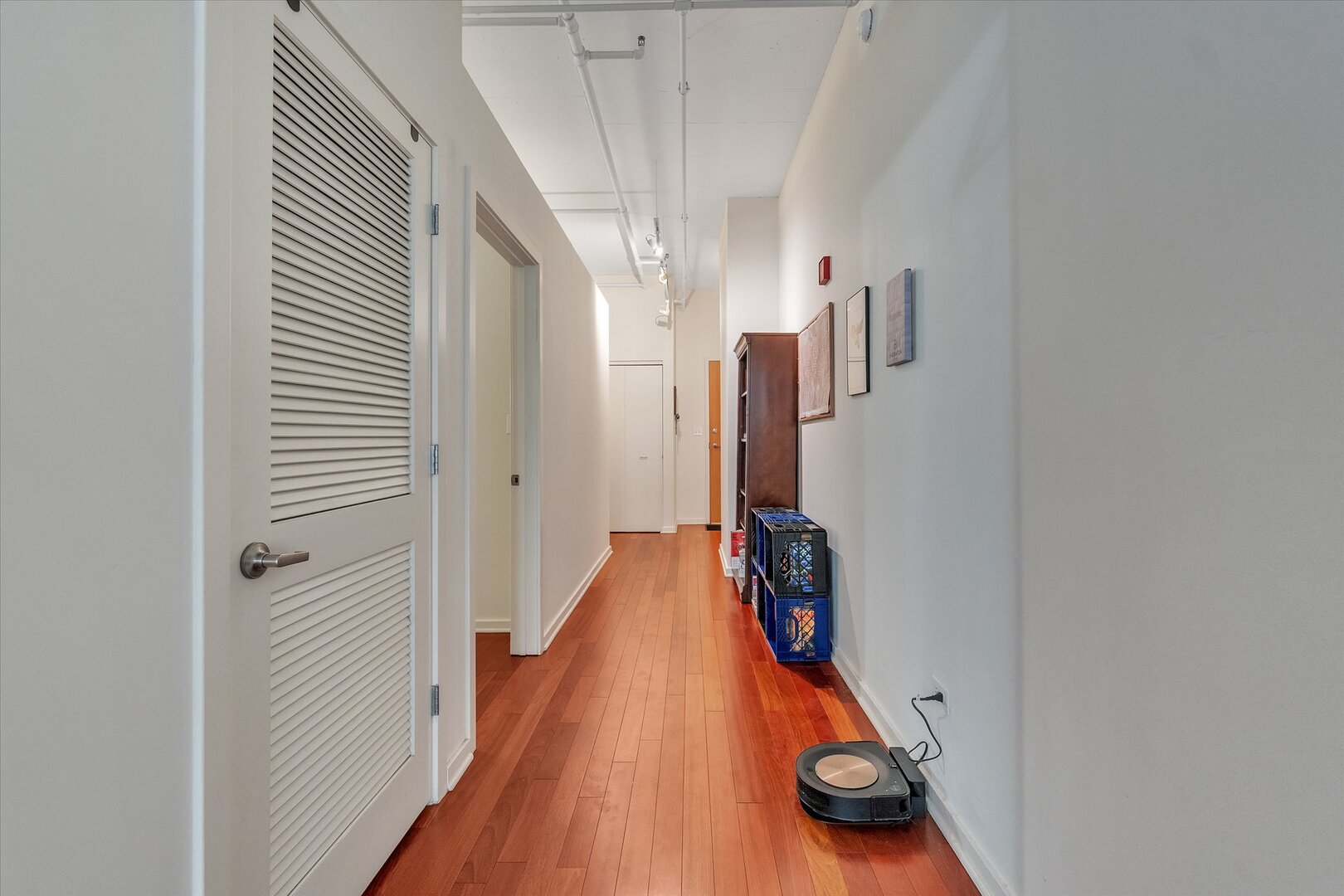 520 South State Street, Unit 805 Chicago, IL 60605 - Photo 8 of 24 a view of a hallway with wooden floor and stairs