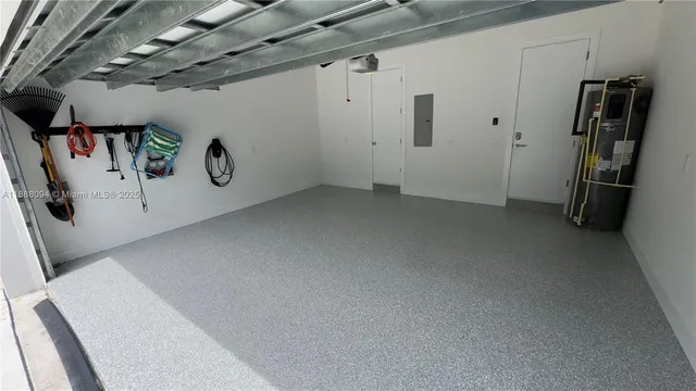 a view of storage and utility room with closet