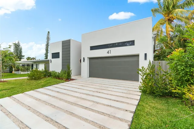 a house with yard in front of it