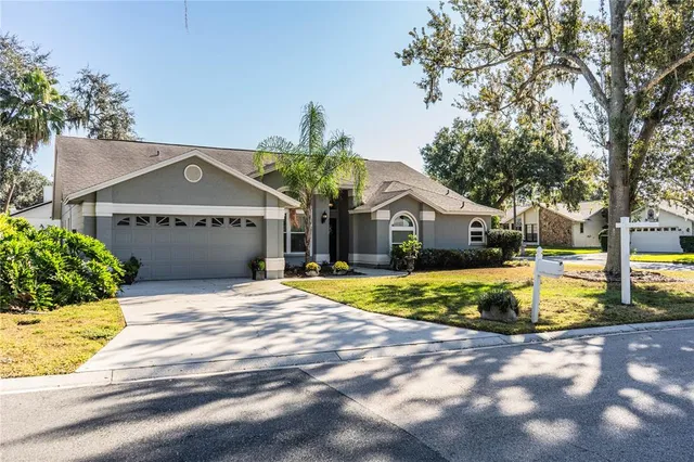 a front view of houses with yard