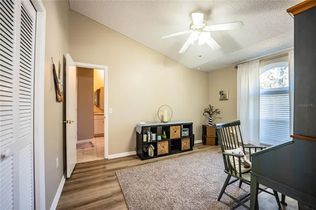 a view of a hallway with furniture and window