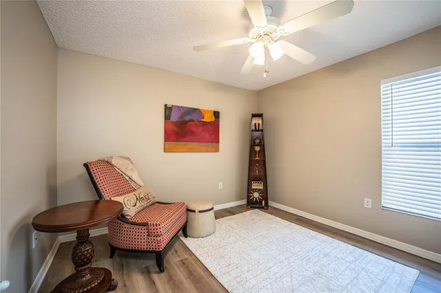 a living room with furniture and a window