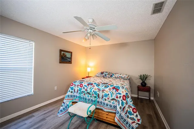 a bedroom with bed and a window