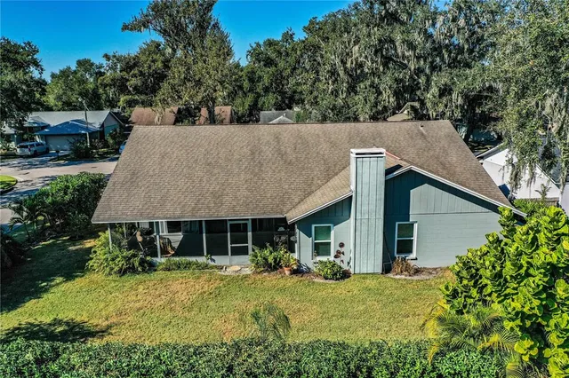 a aerial view of a house with swimming pool and sitting area
