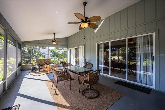 a view of a dining room with furniture wooden floor and a chandelier