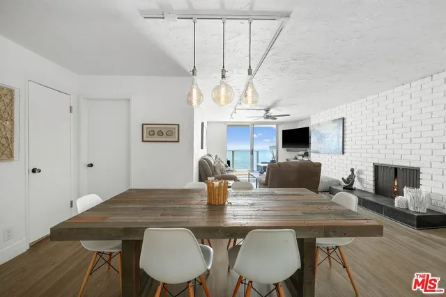 a large bedroom with a bed window and a dresser