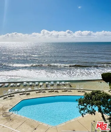 a view of a swimming pool with an ocean view