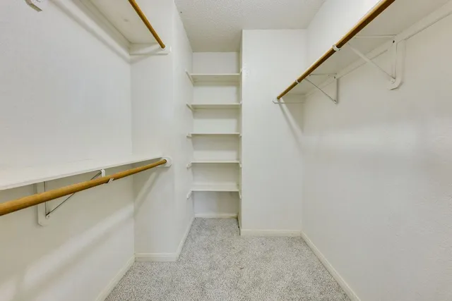 a view of an empty walk in closet
