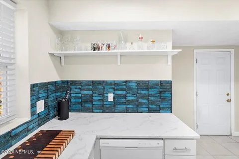 a kitchen with a cabinets and a window