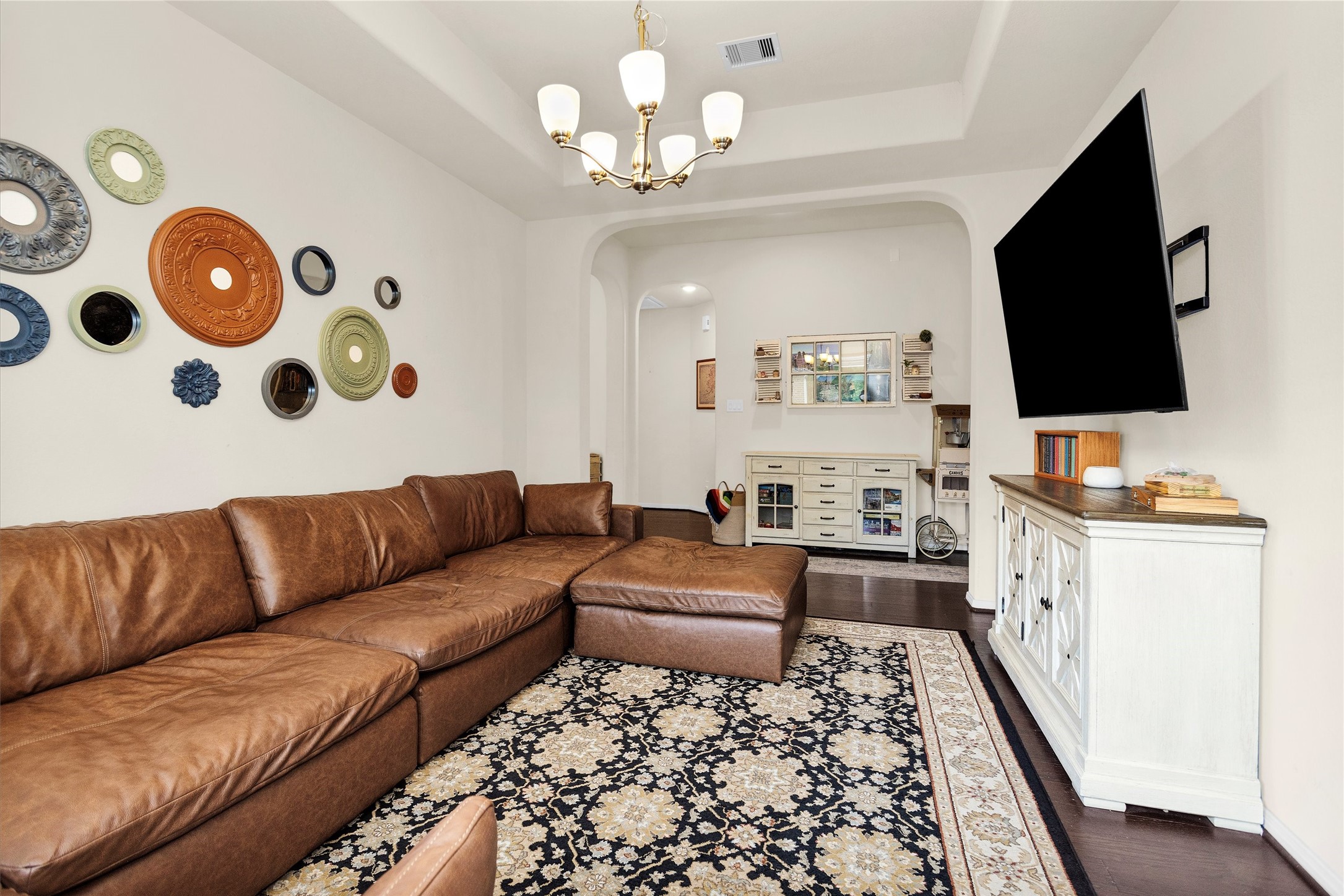 14105 Sun Notch Drive Conroe, TX 77384 - Photo 11 of 31 a living room with furniture and a flat screen tv