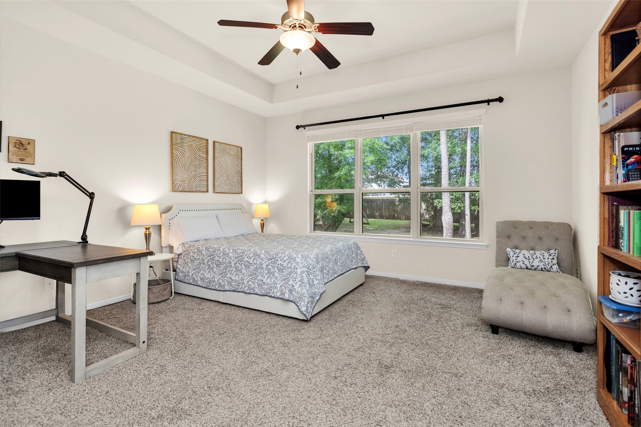14105 Sun Notch Drive Conroe, TX 77384 - Photo 12 of 31 a bedroom with a bed a couch and a window