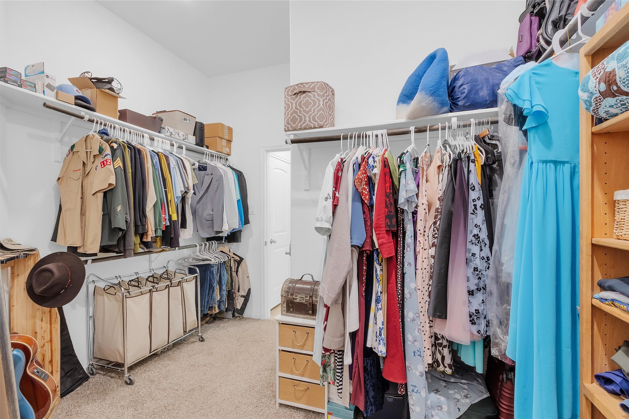 14105 Sun Notch Drive Conroe, TX 77384 - Photo 18 of 31 a view of walk in closet with clothes and shoes