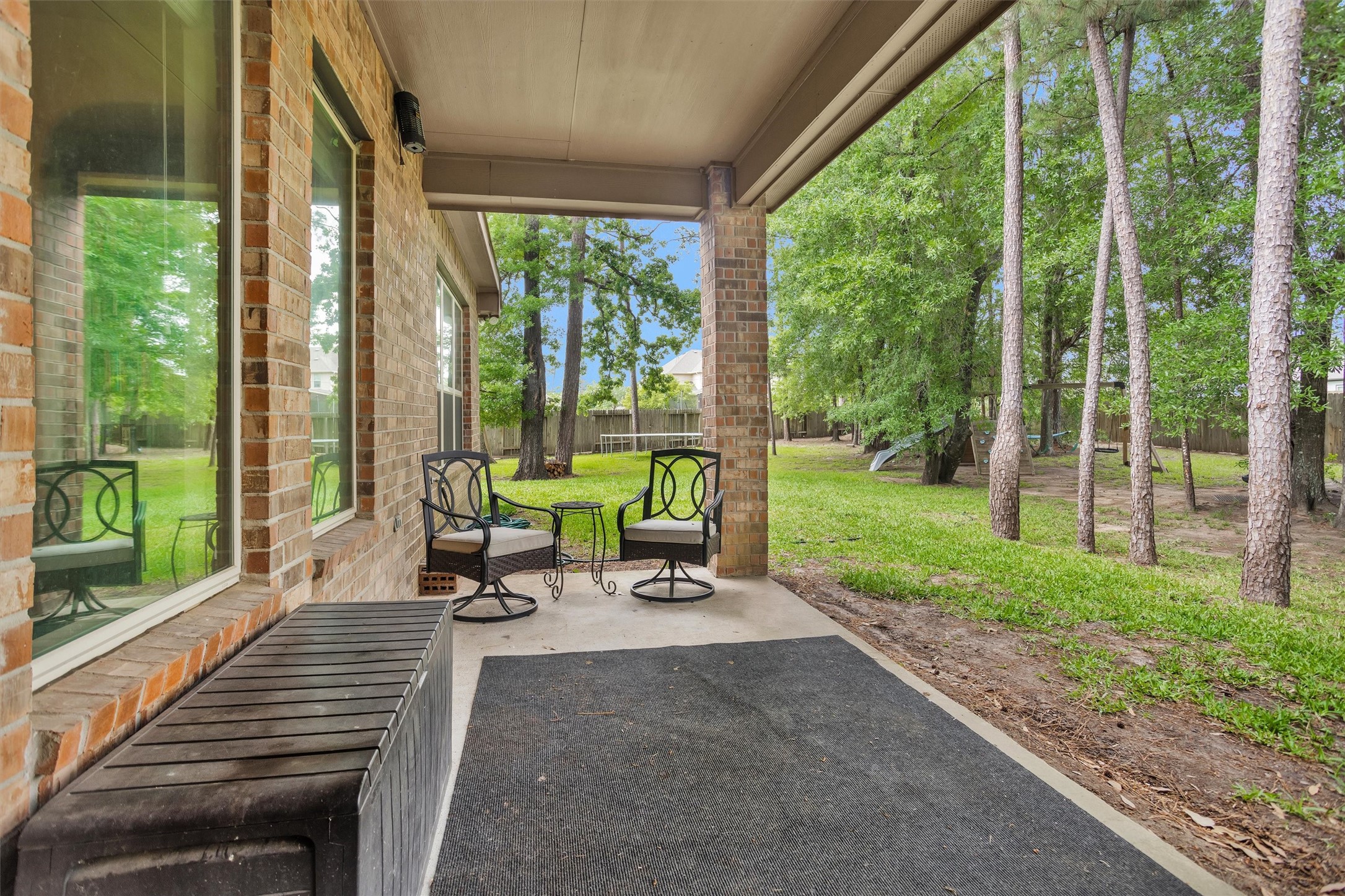 14105 Sun Notch Drive Conroe, TX 77384 - Photo 26 of 31 a view of a house with backyard and porch