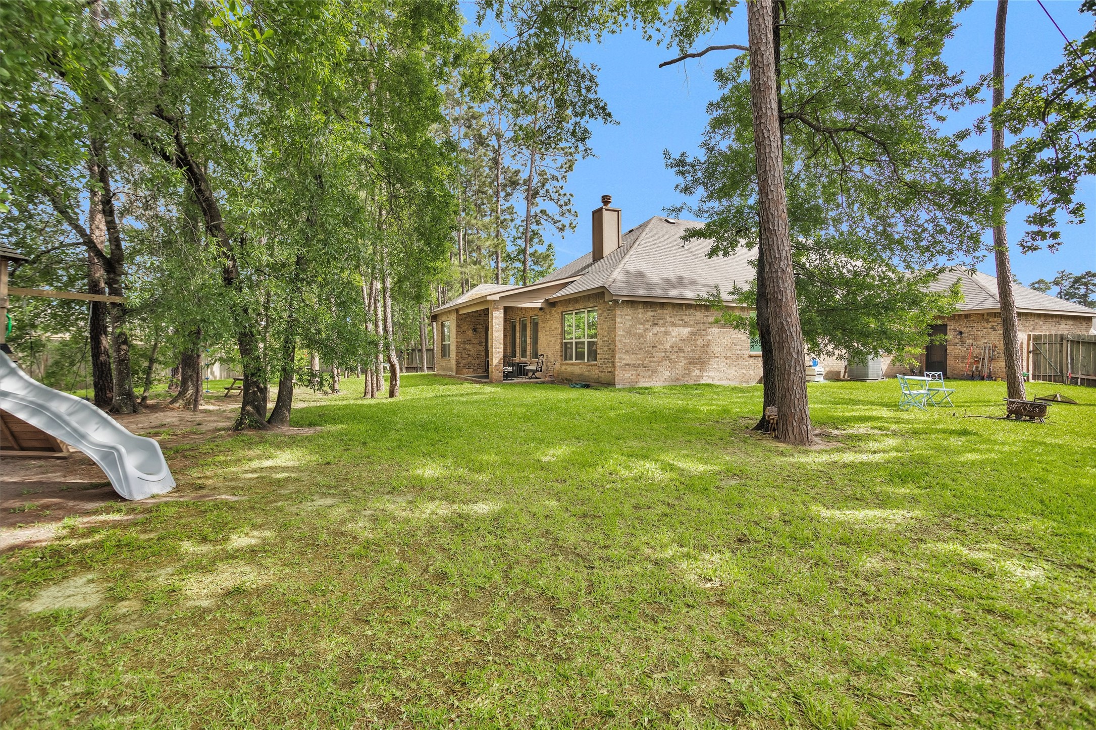 14105 Sun Notch Drive Conroe, TX 77384 - Photo 28 of 31 a view of a house with a yard