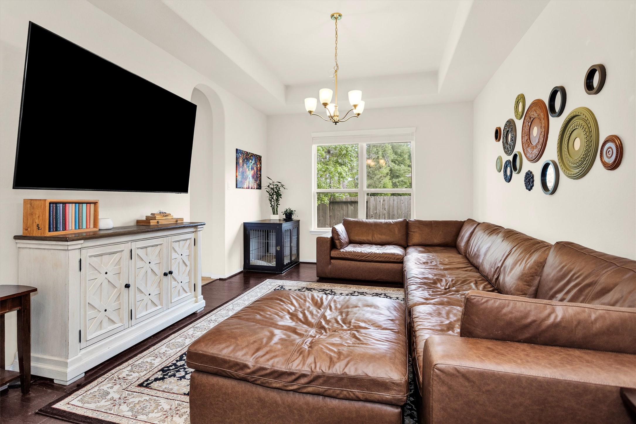 14105 Sun Notch Drive Conroe, TX 77384 - Photo 10 of 31 a living room with furniture and a flat screen tv