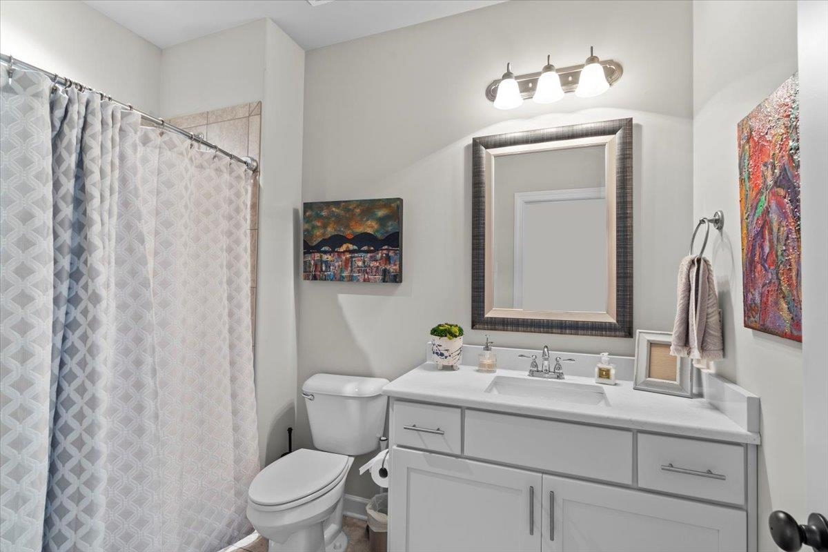 12531 Bravo Road Collierville, TN 38017 - Photo 33 of 40 Full bathroom with vanity and a shower with shower curtain