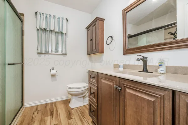 a view of a livingroom with furniture and a bookshelf