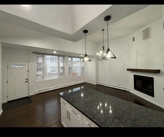 a view of a room with window wooden floor and a ceiling fan