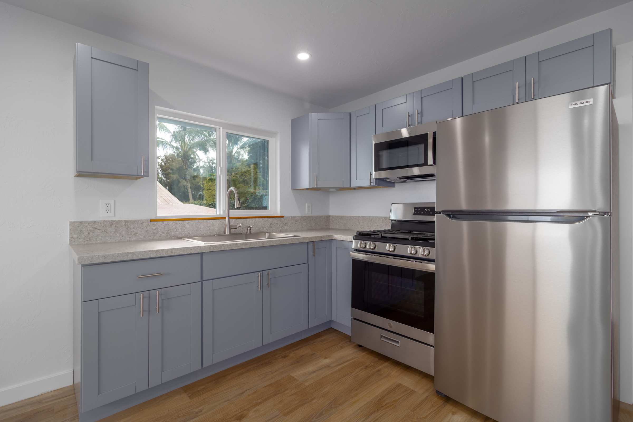 54-2378 Kynnersley Road Kapaau, HI 96755 - Photo 11 of 24 a kitchen with stainless steel appliances a refrigerator sink and microwave