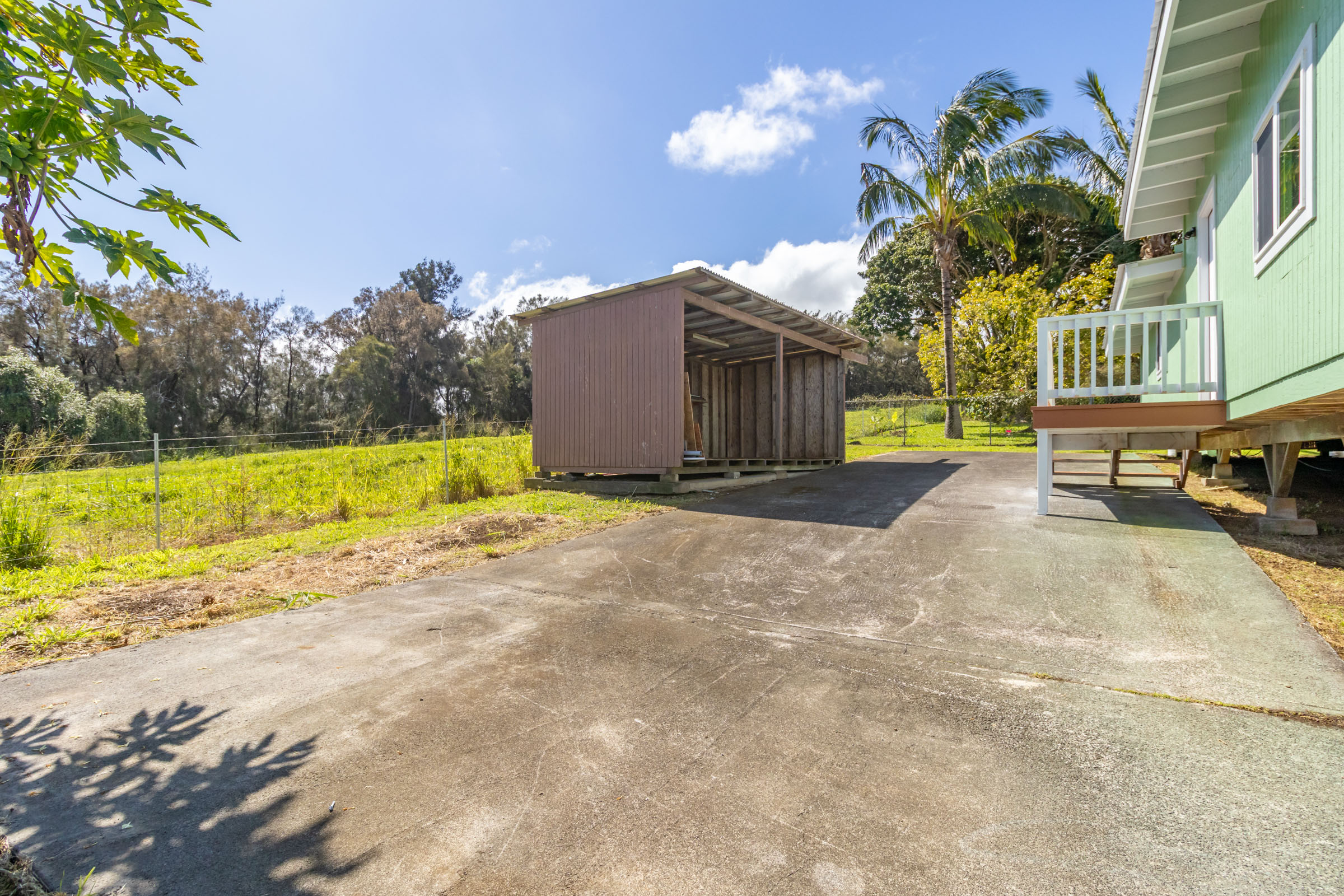 54-2378 Kynnersley Road Kapaau, HI 96755 - Photo 21 of 24 a view of a swimming pool with an outdoor space and seating area