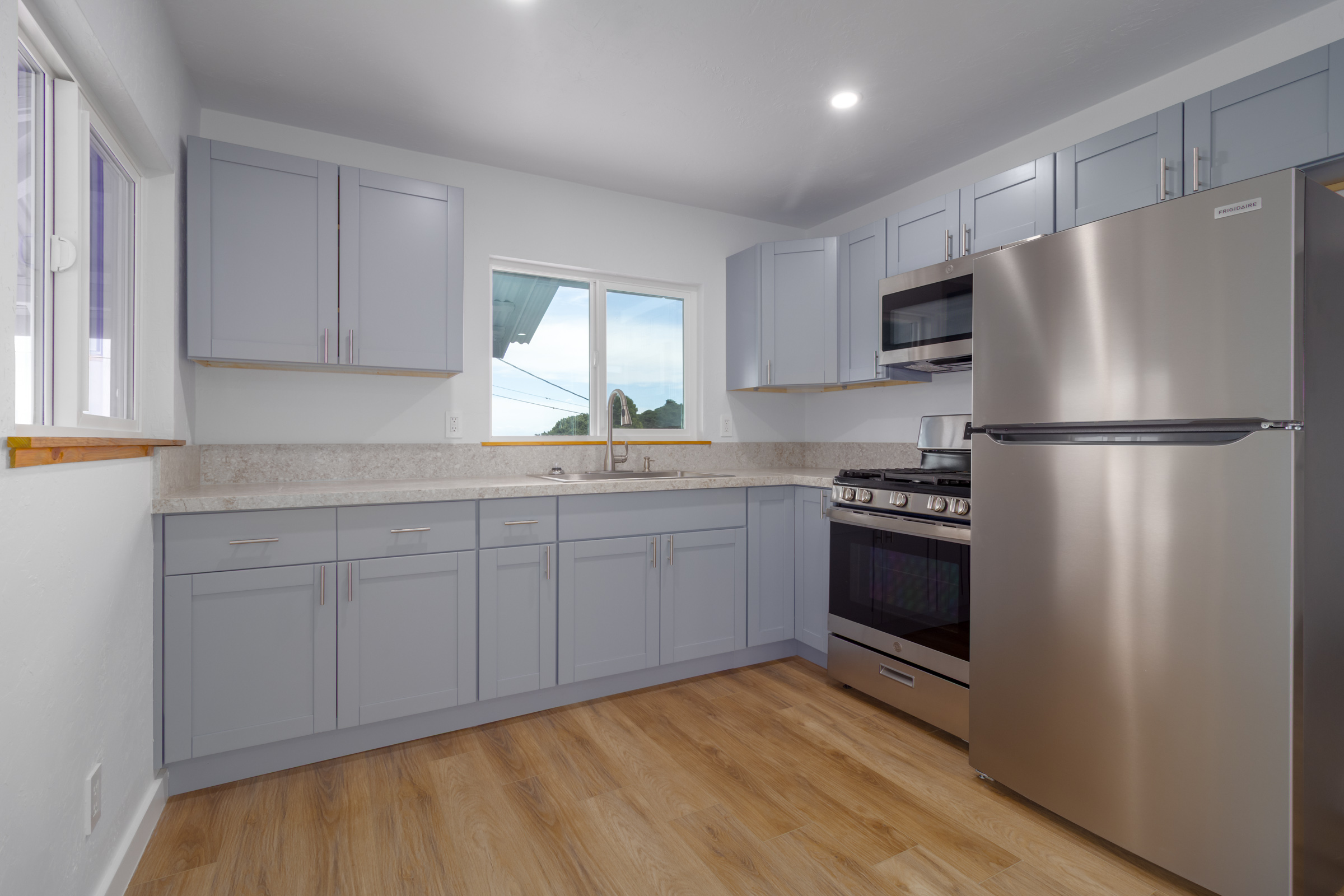 54-2378 Kynnersley Road Kapaau, HI 96755 - Photo 6 of 24 a kitchen with stainless steel appliances a refrigerator sink and cabinets