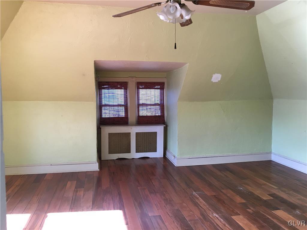 1247 Jackson Street Easton, PA 18042 - Photo 15 of 30 a view of an empty room with wooden floor and a window