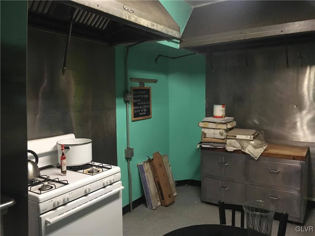 1247 Jackson Street Easton, PA 18042 - Photo 7 of 30 a stove top oven sitting inside of a kitchen