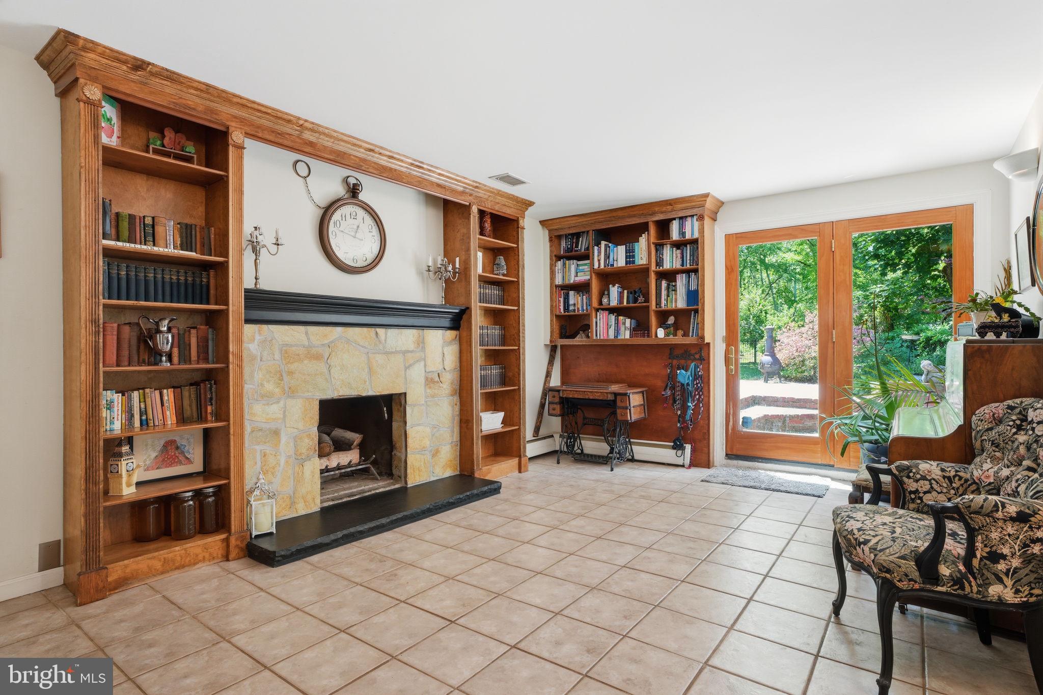 621 River Road Yardley, PA 19067 - Photo 35 of 75 a living room with furniture a window and a fireplace