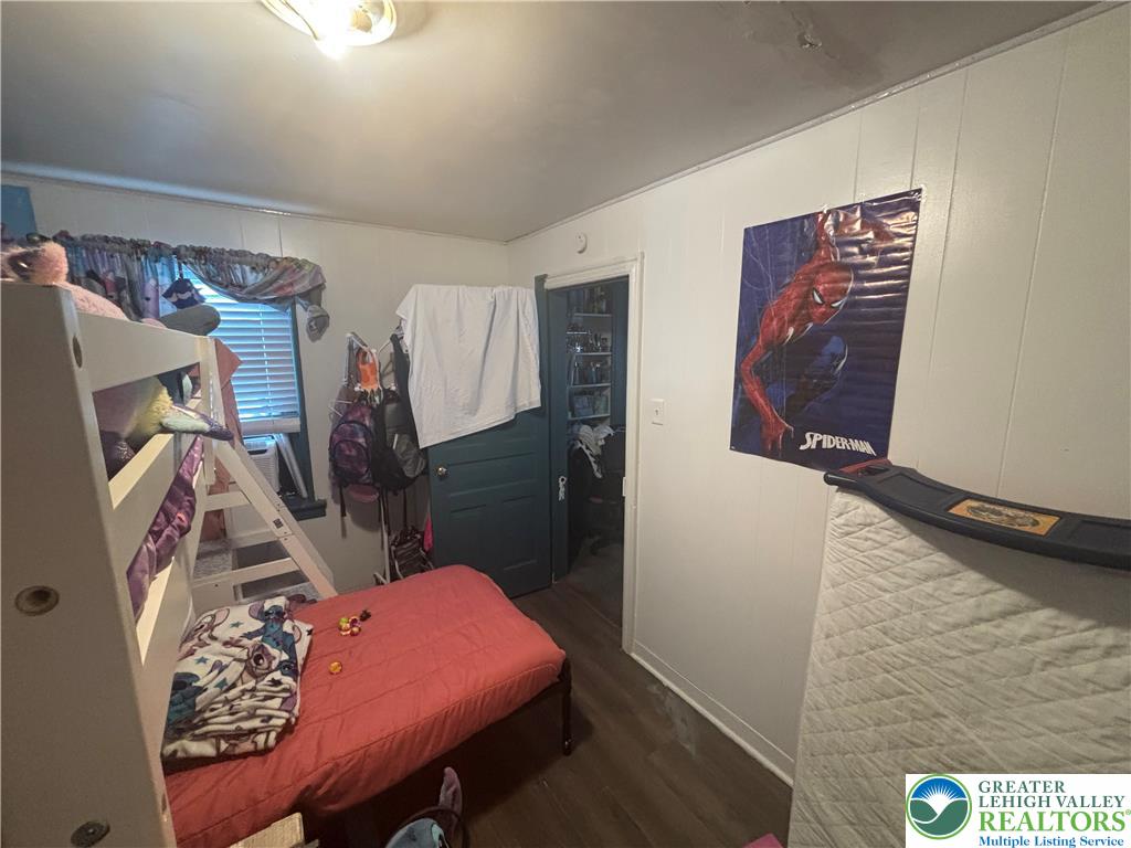 3404 North Ruch Street Whitehall, PA 18052 - Photo 10 of 36 A compact bedroom with hardwood floors offers a cozy, functional living space.
