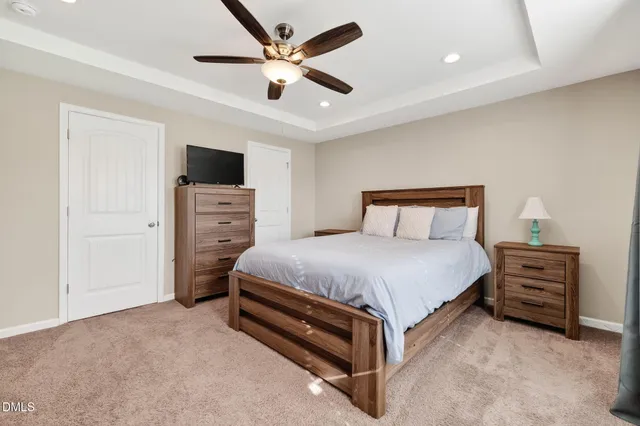 a bedroom with a bed and a dresser