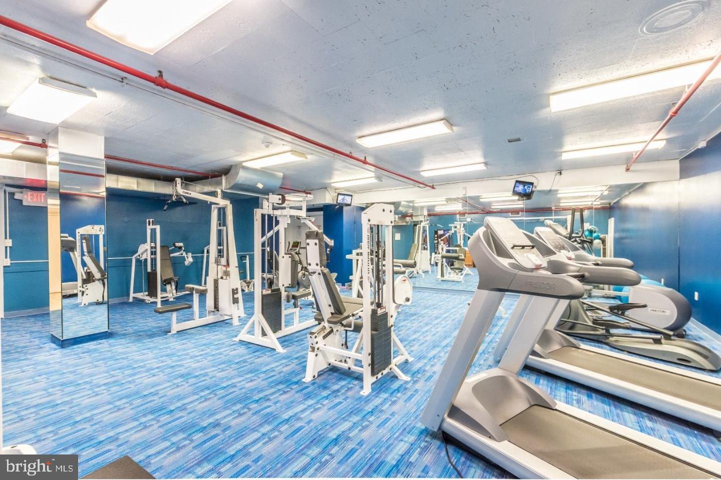 1324 Locust Street, Unit 1125 Philadelphia, PA 19107 - Photo 7 of 8 a view of a room with gym equipment