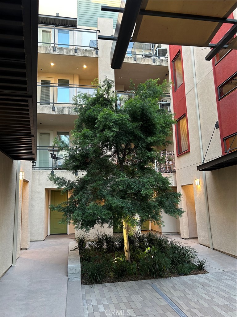 202 Tribeca Irvine, CA 92612 - Photo 15 of 21 a view of a house with a yard