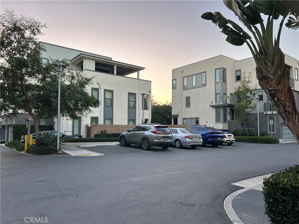 202 Tribeca Irvine, CA 92612 - Photo 18 of 21 a view of street with parked cars