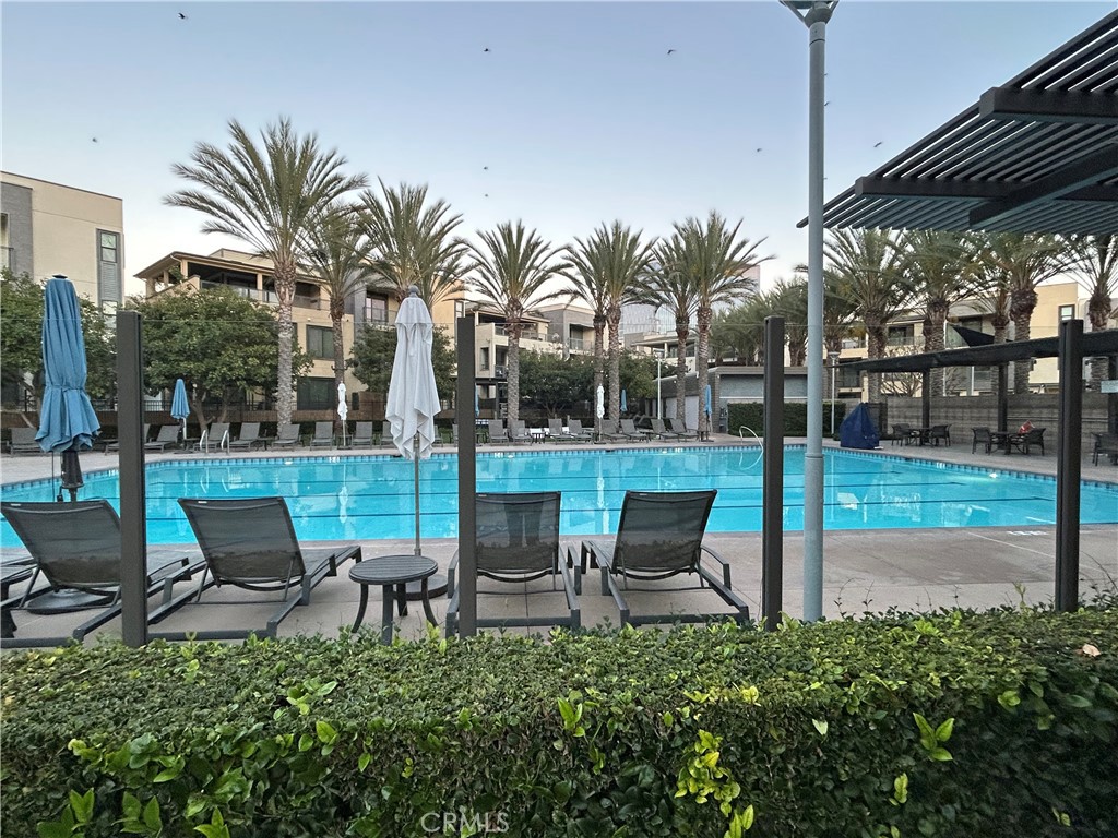 202 Tribeca Irvine, CA 92612 - Photo 21 of 21 a backyard of a house with outdoor seating