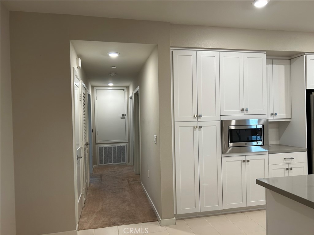 202 Tribeca Irvine, CA 92612 - Photo 5 of 21 a view of a kitchen with electric appliances