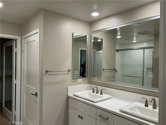 a bathroom with a sink and a large mirror